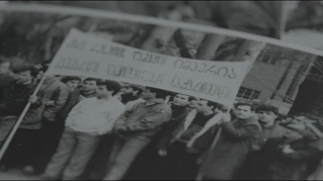 A slow pan across printed photographs of the 9 April 1989 demonstration in Tbilisi, from Georgian Liberty's film
